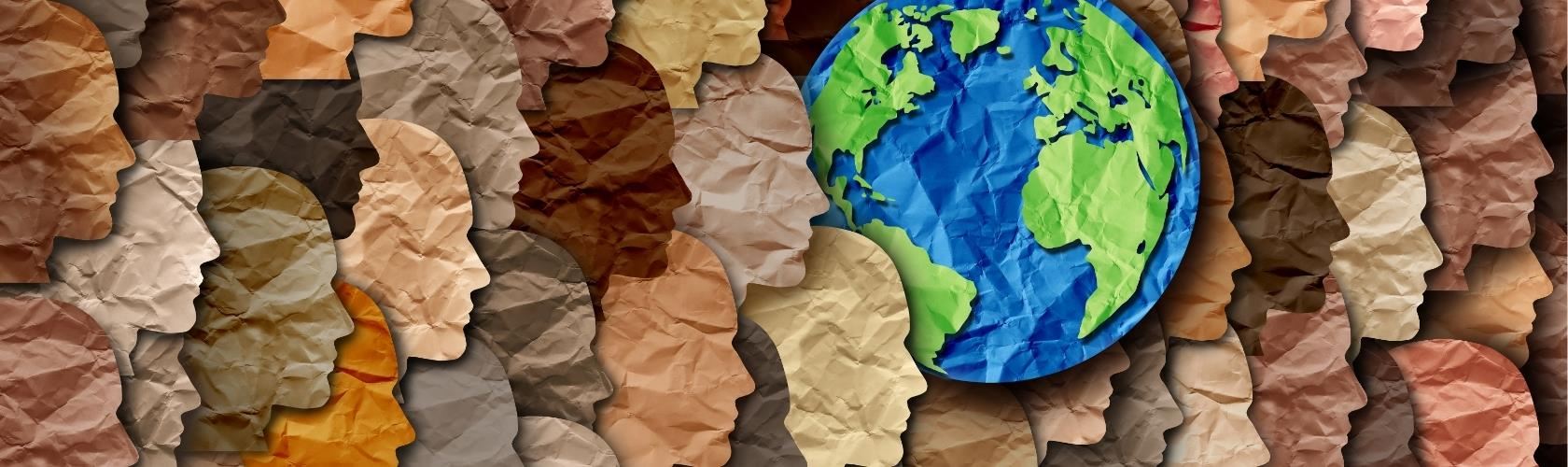 silhouettes of overlapping head outlines made out of multi-toned beige & brown crinkled paper with a blue and green globe